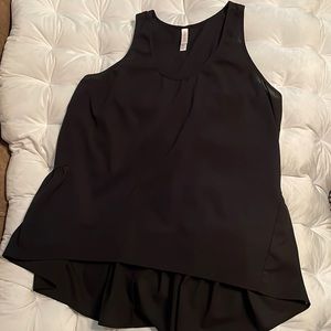 Xhilaration size large. Black sheer short in the front longer in the back.